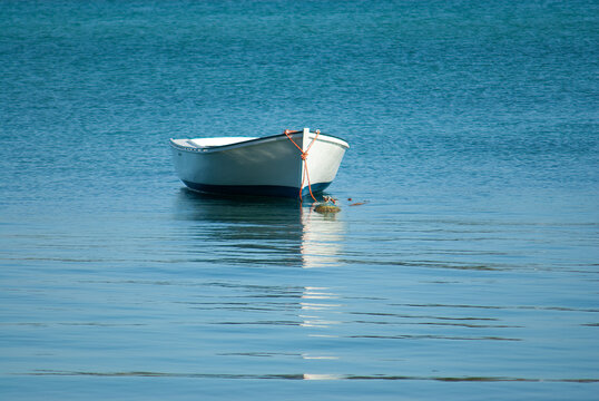 Wooden rowing boat (pirogue) anchored in ocean, Mauritius