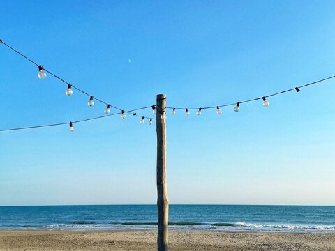 String lights hanging on the beach, Plage des Amphores, Saintes-Maries-de-la-Mer, Camargue, Bouches-du-Rhone, Provence-Alpes-Cote-d'Azur, France