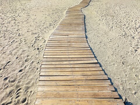 Close-up of a wooden walkway on Plage des Amphores, Saintes-Maries-de-la-Mer, Camargue, Bouches-du-Rhone, Provence-Alpes-Cote-d'Azur, France