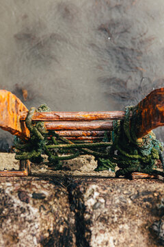 Overhead view of a Weathered and rusty metal Ladder on a sea wall, Ireland