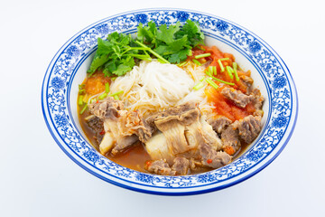 A bowl of tomato steak rice noodles