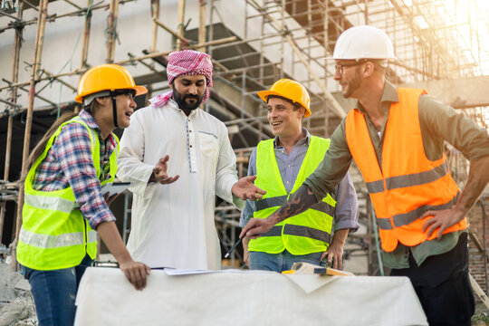 Architect engineer technician construction worker all working together as a team, working communicating on blueprint design planning analyzing innovation on building landscape housing architecture.
