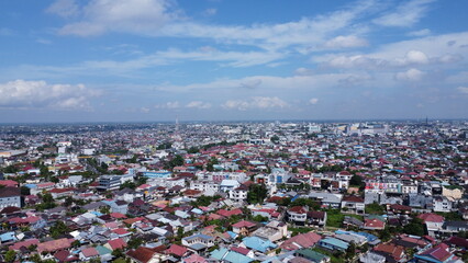 Aerial view of the dense city of Banjarmasin which is full of housing, high rise buildings and malls
