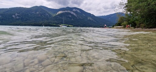 Camping by Lake Wolfgangsee offers a serene experience with access to swimming beaches and piers. Visitors can enjoy the clear waters of Wolfgangsee, relax on the beach, or take a swim. The piers prov