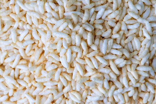 Close-up background of puffed rice or muri (also known as murmura, kurmura, popped rice, puha, mamra, mandakki, murmure).