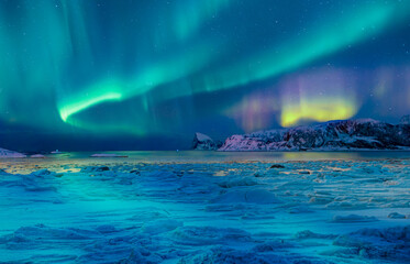 Cracks on the surface of the green ice next to white lone house (cabin) in winter - Frozen lake -...