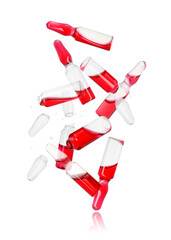 Obraz premium Many ampoules and glass pieces falling on white background