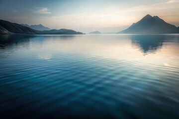 Calm morning serenity reflecting the mountains and sky over tranquil waters at dawn in a picturesque landscape. Generative AI