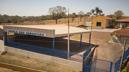 Drone view of Cachoeirinha rural neighborhood and Sao Sebastiao Chapel in Barretos, Sao Paulo, Brazil