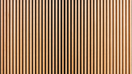 Wall made of wooden panels. Vertical wooden slats for facade cladding. Timber stripes made of beige pine. A modern plank surface for interior and exterior design.