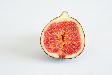 a fig fruit with the red center isolated on white   