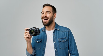 Man Smiling with a Camera in His Hand