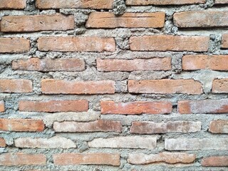 Red brick wall with rough and coarse texture 