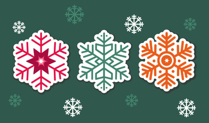 set of three flat simple christmas green, red, orange snowflakes on green background. vector group of winter elements