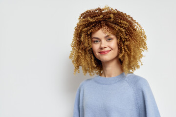 curly hair, woman, smiling, portrait, cheerful expression, natural beauty, indoor setting, soft...