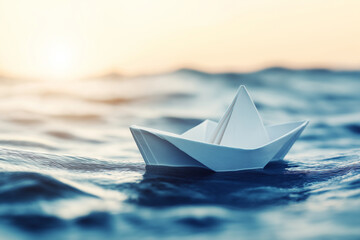 Obraz premium Paper boat floating on calm water at sunset, symbolizing tranquility, adventure, and childhood memories, perfect for peaceful and nostalgic marine-themed concepts