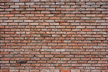 Naklejka premium Old decorative wall made of red bricks.
