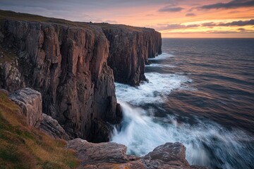 Fototapeta premium Dramatic Sea Cliffs and Waves at Sunset