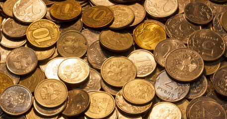A close up view of variety of Russian ruble coins in different denominations and colors.