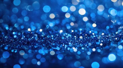 Sapphire glitter bokeh background. Unfocused shimmer royal blue sparkle. Crystal droplets wallpaper