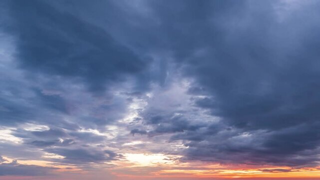  The Sun Setting over the Horizon and Feathery Colorful Clouds Fast Lapse Time. 
