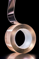 Roll of adhesive nano tape double-sided on dark background