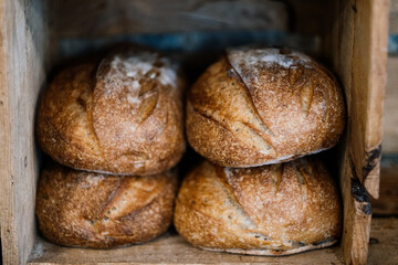 loaf of sourdough bread on wooden table