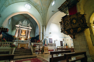 Fototapeta premium The historical Castelsardo Cathedral against the blue Mediterranean sea in Sardinia - 3 mai 2024
