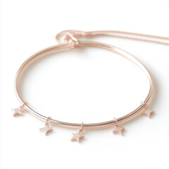 A gold bracelet with five stars hanging from it