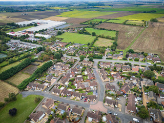 Aerial view of an established housing development in the UK. Showing both detached bungalows and...