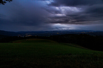 Evening view of the sunset over the Black Forest with heavy cloud cover and rain