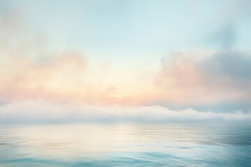 Obraz premium Calm Ocean at Dawn with Misty Clouds
