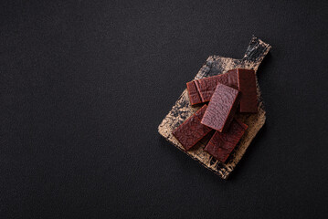 Rectangular chocolate candies with mousse and waffles