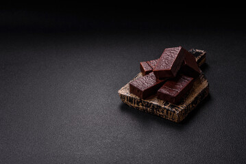 Rectangular chocolate candies with mousse and waffles