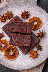 Rectangular chocolate candies with mousse and waffles