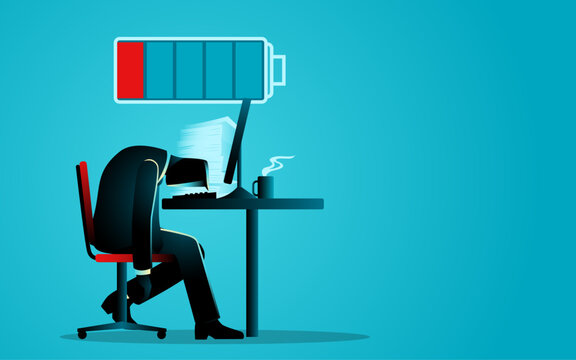 Businessman working weary on computer with a low battery icon, representing themes of corporate burnout, work life imbalance, and exhaustion