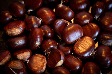 Close up of chestnuts on a frying pan