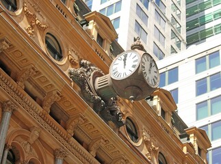 Three sided vintage clock on the Former General Post Office building now The Fullerton Hotel Sydney