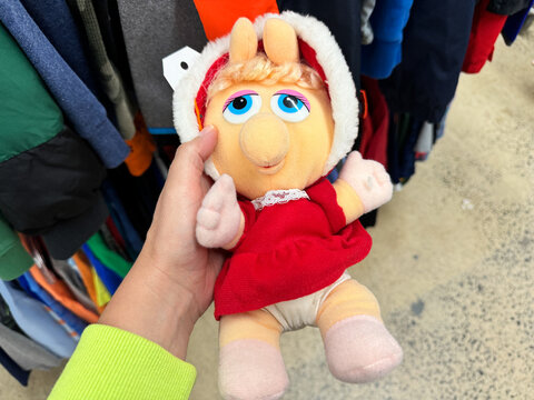 Vienna, Virginia - September 28, 2024: Hand holds a Vintage 1987 80s Miss Piggy Stuffed Plush Muppet Babies Collectible Toy