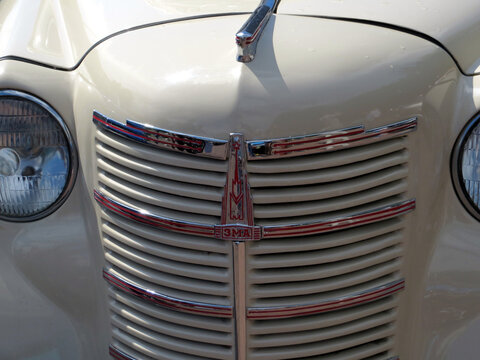 Lviv, Ukraine - June 5, 2016 Classic Vintage Car ZMA Moskvitch Grille Details Showcasing Chrome Accents and Elegant Design in Sunlight