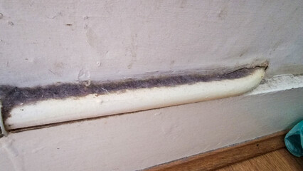 Close up of a dirty pipe in a house