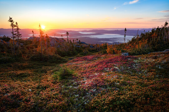 Majestic sunrise over mountains of Charlevoix, and the vibrant colors of Fall, QC, Canada