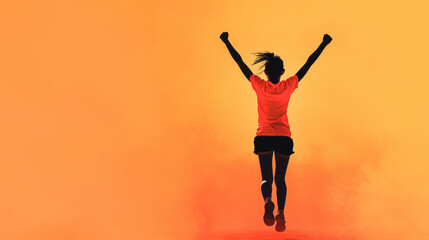 runner crossing finish line with arms raised in celebration, showcasing triumph and joy against vibrant orange background. This moment captures essence of victory and achievement