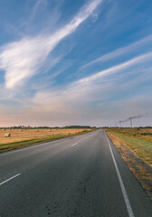 Naklejka premium A long road with a clear blue sky above it