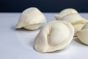 Cooking dumplings. Frozen raw dumplings. Copy space for your advertisement and text