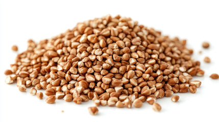 Fototapeta premium A close-up pile of buckwheat groats isolated on a white background.