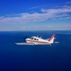 Fototapeta premium Aeroplane in the sky over the ocean