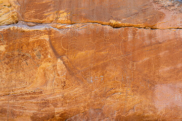 Petroglyphs, picture writing, Medicine Lodge State Archaeological Park, Wyoming, USA.  Images on sandstone cliffs, pecked & painted at one of the major art localities of Northwestern Plains Indians.