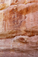 Petroglyphs, picture writing, Medicine Lodge State Archaeological Park, Wyoming, USA.  Images on sandstone cliffs, pecked & painted at one of the major art localities of Northwestern Plains Indians.