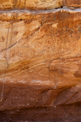 Petroglyphs, picture writing, Medicine Lodge State Archaeological Park, Wyoming, USA.  Images on sandstone cliffs, pecked & painted at one of the major art localities of Northwestern Plains Indians.